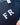 Navy blue bag with white initials 'FR' held by a person wearing a light blue shirt.