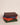 Stack of closed leather poker sets in green, orange, burgundy, and navy—elegant, gift-ready presentation in multiple colors.