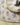 Reversible shell-shaped placemat in floral-printed cotton. Hand silk-printed and padded for softness—a romantic, sea-inspired touch for any table. Shop L'amour des Bonbons on TREATTS