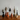 Set of unique, abstract sculptures on a wooden surface with a plain background